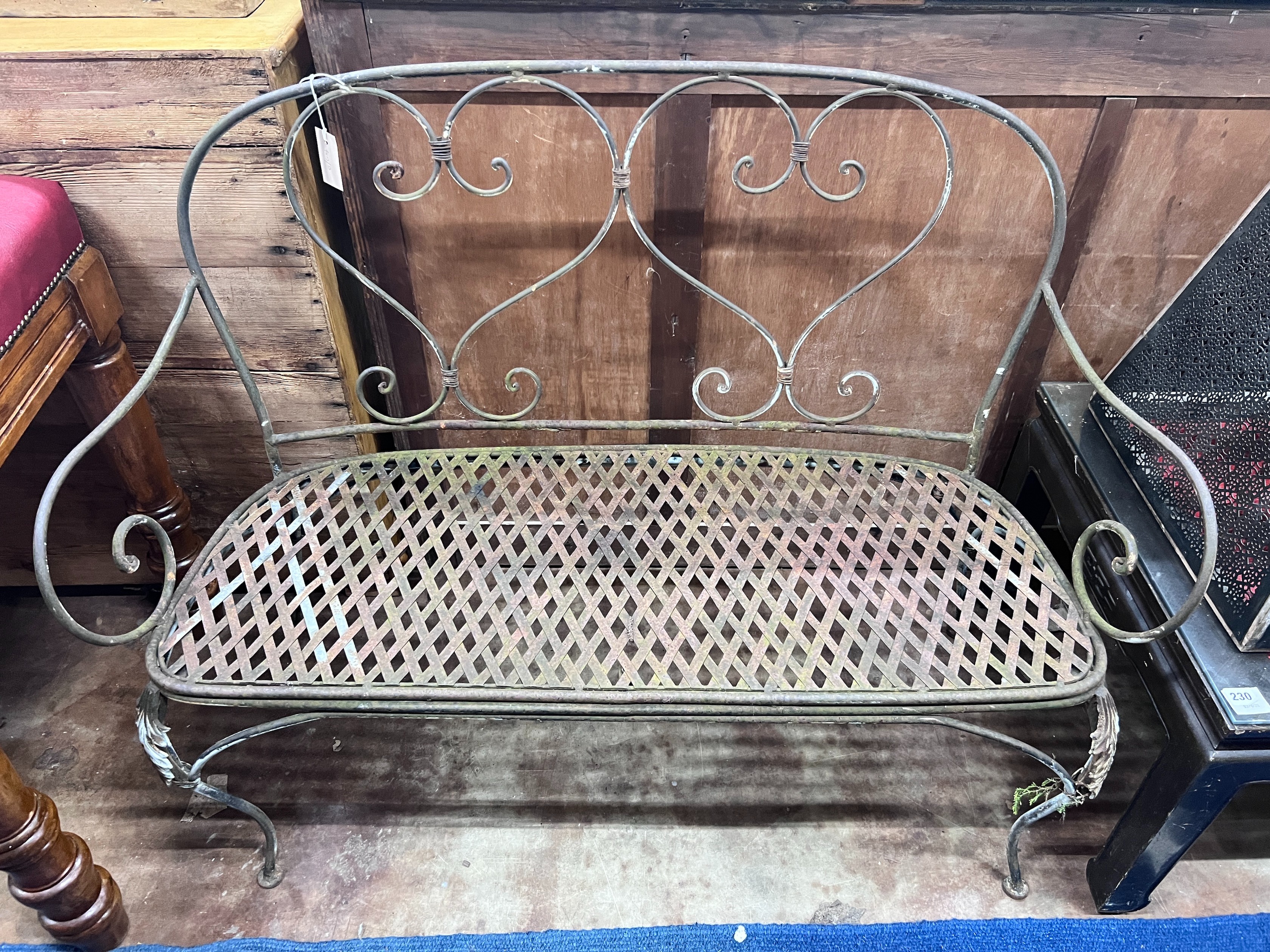 A wrought iron garden bench, width 120cm *Please note the sale commences at 9am.